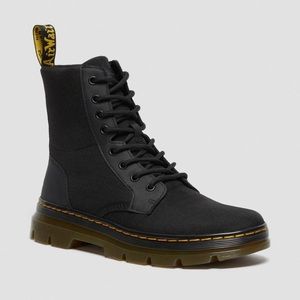 Black Dr. Martin tie up boots.